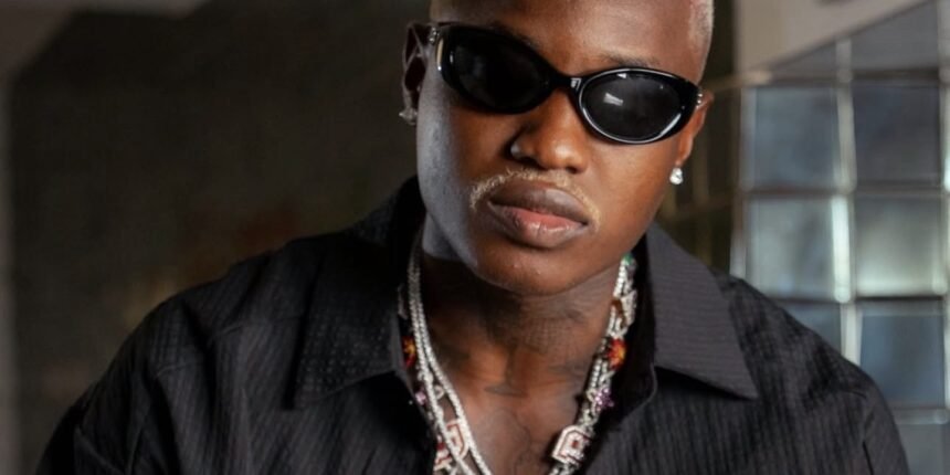Afrobeats singer Ruger posing for a photo shoot
