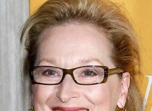 Movie actress Meryl Streep smiling at a red carpet event.