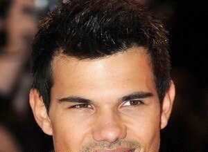 Taylor Lautner smiling at a public event