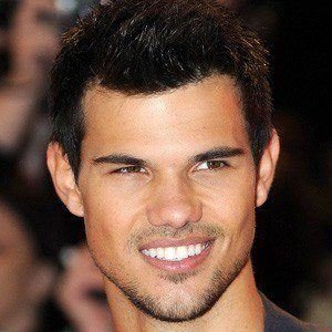 Taylor Lautner smiling at a public event