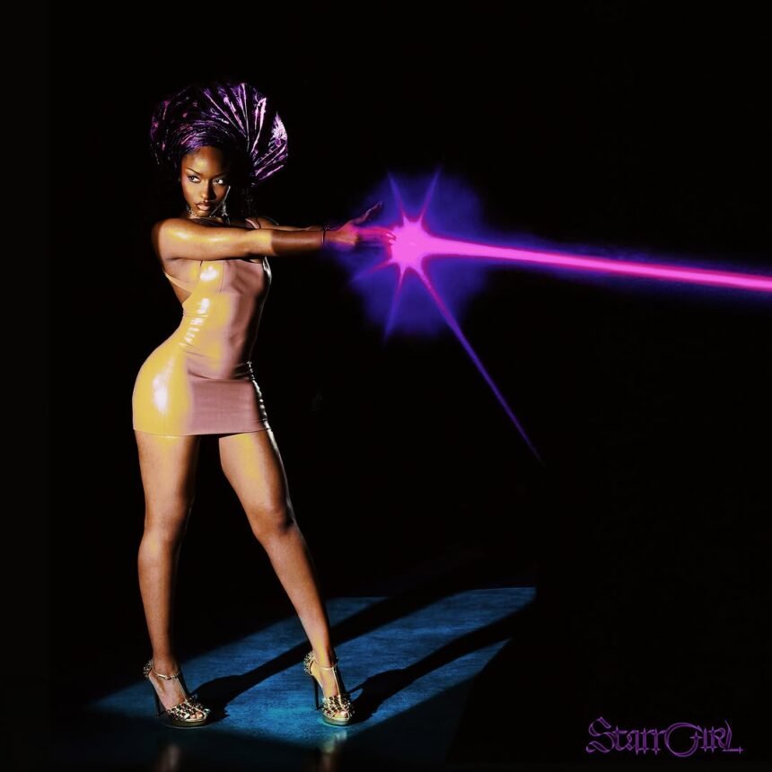 Ayra Starr performing in a stylish outfit during a music production shoot