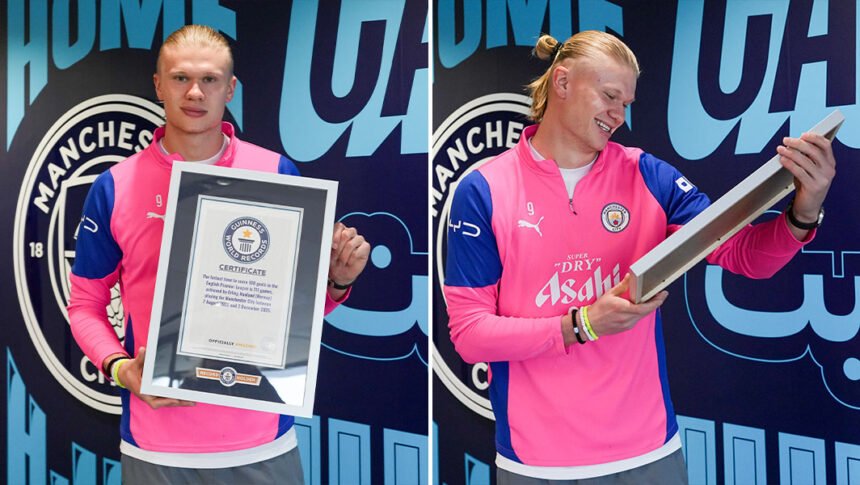 Erling Haaland standing proud while holding his four official Guinness World Records certificates at Etihad Stadium