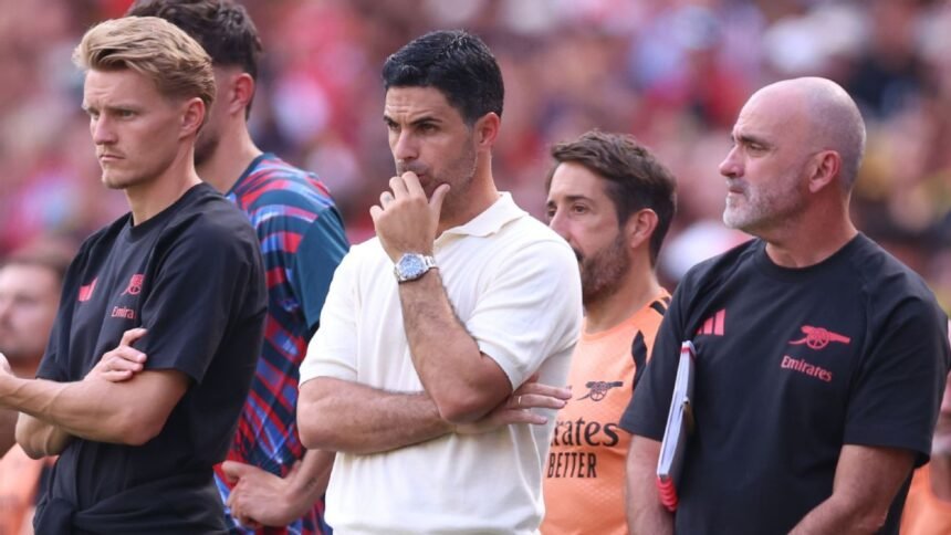 Mikel Arteta standing on the pitch