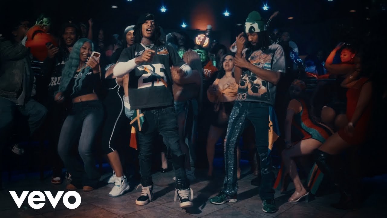 JETTI and DJ CHEEM performing in the official Party Lit music video.
