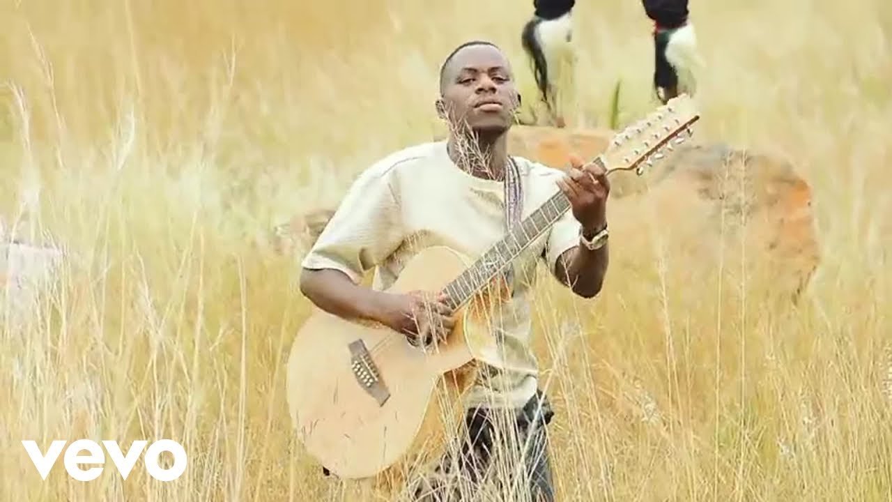 MENZI MUSIC performing in the official music video for Vuma