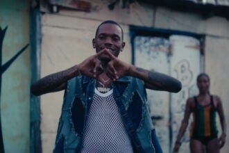 Valiant and Di Genius in the official music video for Woii on Hill & Gully Riddim