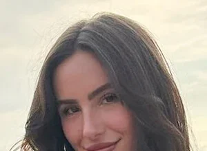 Ashtin Earle smiling for a portrait photo