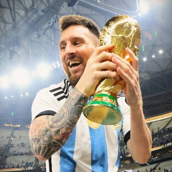 Lionel Messi lifting the World Cup trophy for Argentina