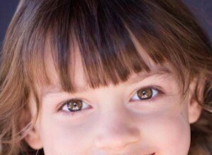Maya Le Clark smiling at a photo session.