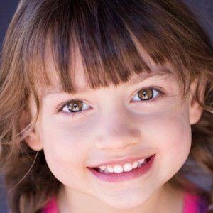 Maya Le Clark smiling at a photo session.