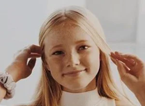 Rylee Arnold smiling during a portrait session
