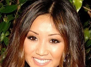 Brenda Song smiling at an event