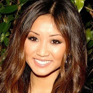 Brenda Song smiling at an event
