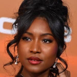 Carlacia Grant smiling while posing at a red carpet event.