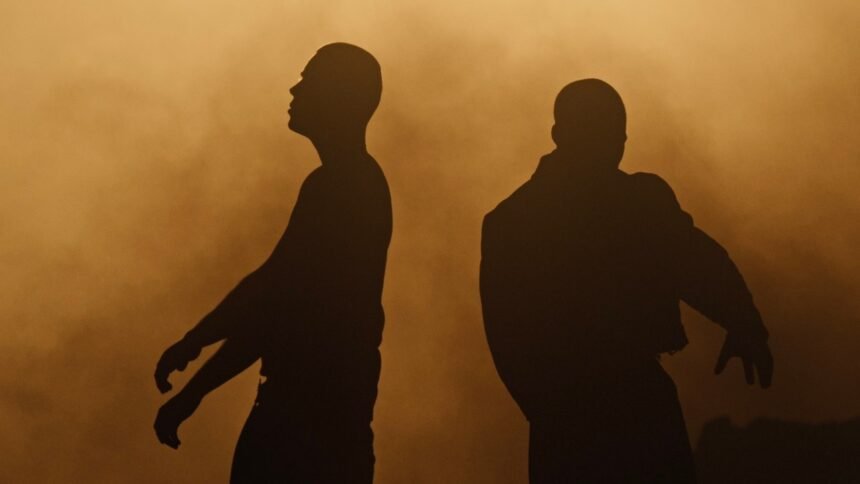 Screenshot of The Kid LAROI and GIVĒON performing in the official "GET EVEN" music video, showing the director's visual style.