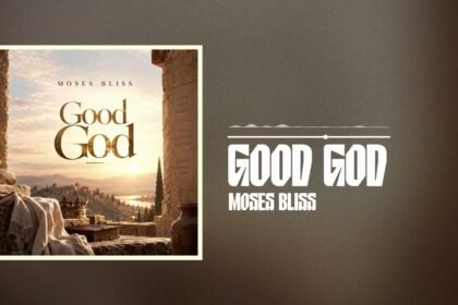 Moses Bliss singing the song Good God on stage, wearing a white shirt with a cheering crowd behind him.