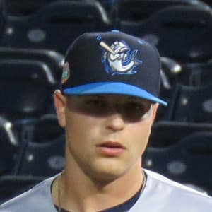 Janson Junk pitching for the Los Angeles Angels in a 2022 baseball game, wearing the team uniform.