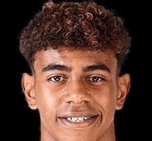 Lamine Yamal in a Spain jersey, arms raised, smiling after scoring a goal in the 2026 World Cup final