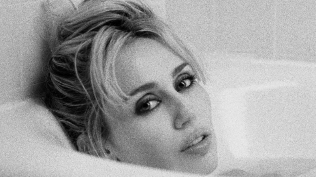 MILEY performing in the official "Let's Get Married" music video, filmed at Chateau Marmont with a stylish set and full production crew