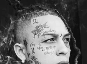 Lil Skies holding a microphone and singing on stage during a concert
