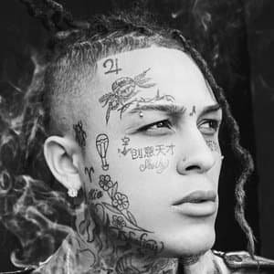 Lil Skies holding a microphone and singing on stage during a concert