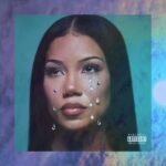 Jhené Aiko performing in a music video