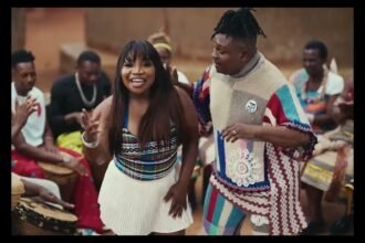 Nelson Tivane and Makhadzi Entertainment performing in the “Mama’s Baby” video, with simple lighting and natural background.