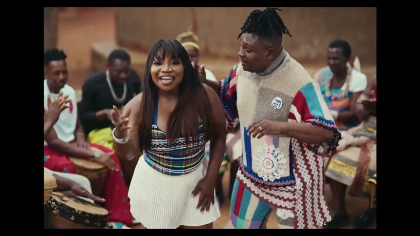 Nelson Tivane and Makhadzi Entertainment performing in the “Mama’s Baby” video, with simple lighting and natural background.
