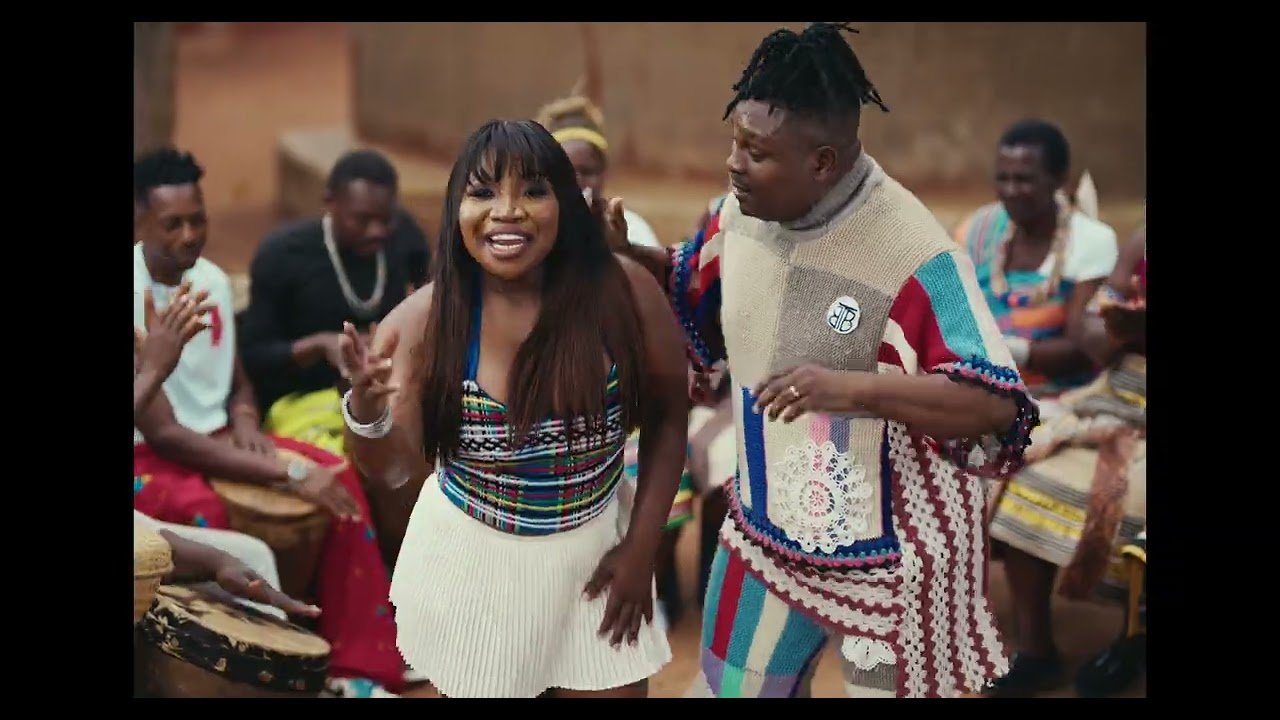 Nelson Tivane and Makhadzi Entertainment performing in the “Mama’s Baby” video, with simple lighting and natural background.