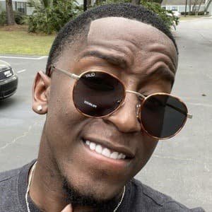 Markell Washington dancing in a bright studio, wearing a casual outfit, captured during a TikTok video.