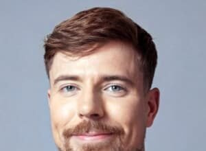 James Stephen Donaldson, known as MrBeast, speaking on stage during a charitable event in 2025