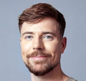 James Stephen Donaldson, known as MrBeast, speaking on stage during a charitable event in 2025