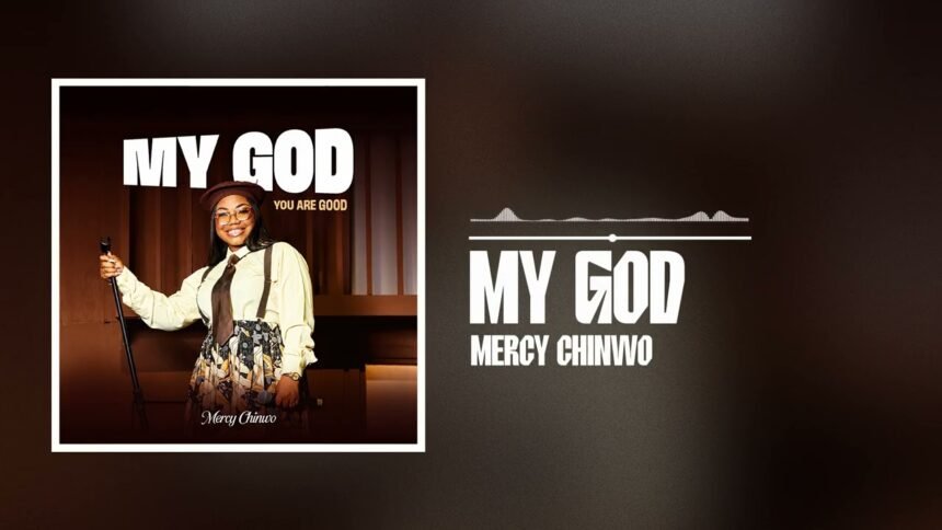 Mercy Chinwo singing the gospel song My God on stage with a microphone