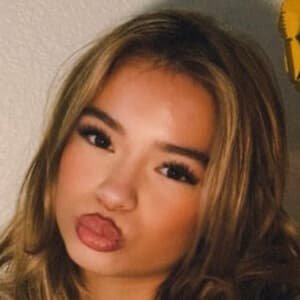 PresLee Faith, a teenage TikTok beauty influencer, smiling in a casual outfit during a video shoot in Dallas, Texas.