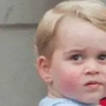 Prince George of Wales smiling during a royal public appearance.