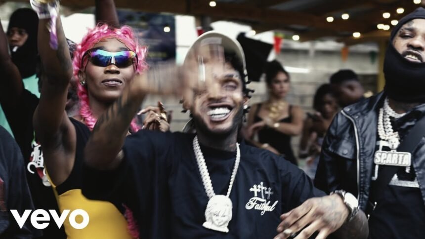 Tommy Lee Sparta and Skeng standing together on a colorful set, wearing street style clothing, performing the song "Protocol 3"