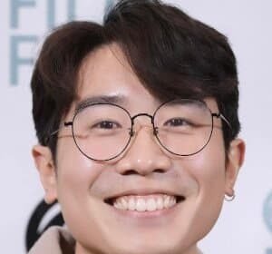 RJ Siu smiling and standing outdoors