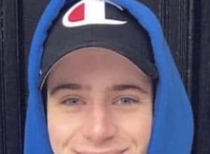 Scott Kress, a 27-year-old TikTok influencer from Kirkwood, Missouri, smiling while holding his phone.