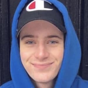 Scott Kress, a 27-year-old TikTok influencer from Kirkwood, Missouri, smiling while holding his phone.