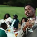 Kwesi Arthur performing in the Yawa Hosanna official music video