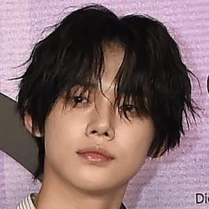 K-pop singer Yeonjun posing for a portrait.