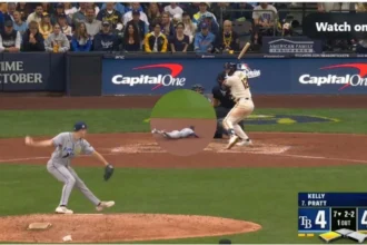 Milwaukee Brewers players celebrating on the field after winning Game 2 of the World Series
