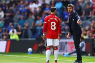 Manchester United players lining up for a Premier League match against Bournemouth