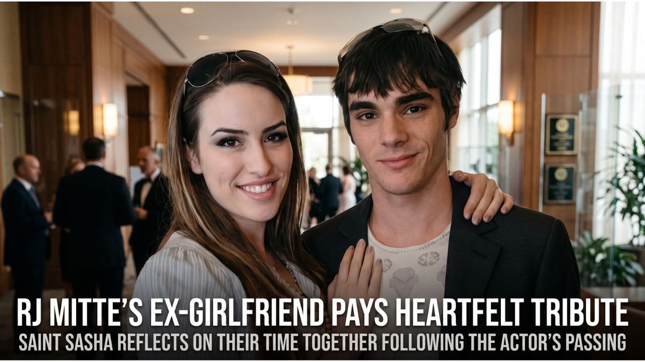 Saint Sasha and RJ Mitte smiling together at home, captured in a warm, natural light photograph.