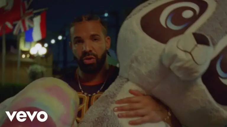 Drake, Don Toliver and Yebba performing Cold Shoulder in the official music video, showing the three artists on stage with bright lighting and a dark background.