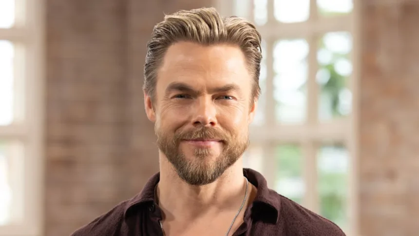 Derek Hough smiling alongside his late dog Romie in a sweet tribute photo.
