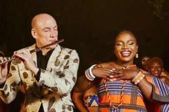 Wouter Kellerman playing flute beside Makhadzi Entertainment singing on stage during the Drum In My Heart performance