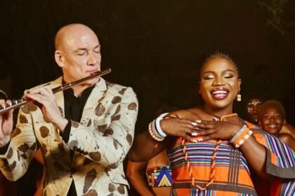 Wouter Kellerman playing flute beside Makhadzi Entertainment singing on stage during the Drum In My Heart performance