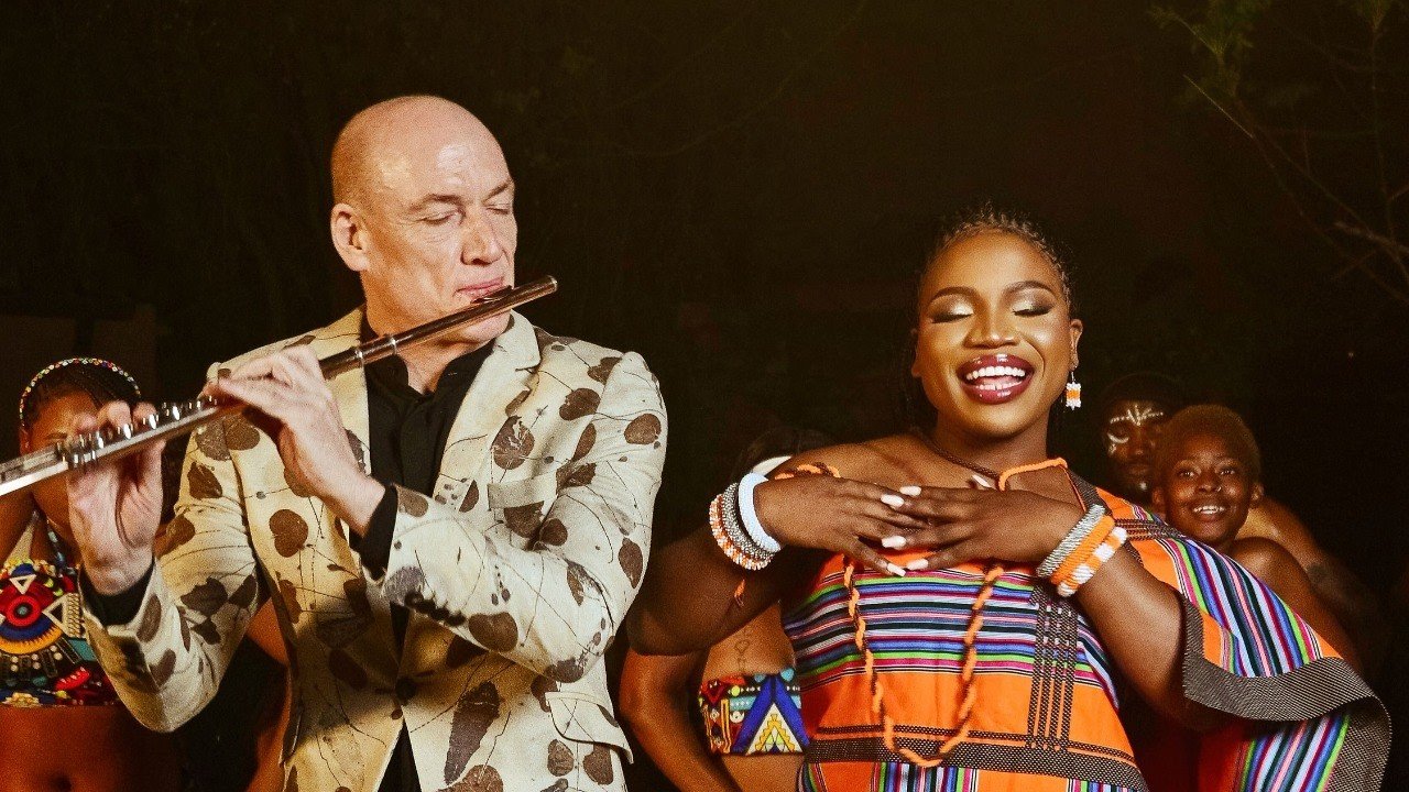 Wouter Kellerman playing flute beside Makhadzi Entertainment singing on stage during the Drum In My Heart performance