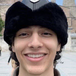 HamzahTheFantastic smiling while filming a TikTok comedy video in a bright room